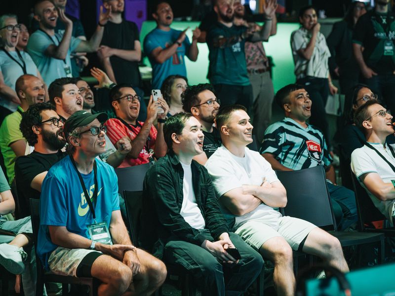 Students in the audience laughing and watching the competition unfold at the European Open.