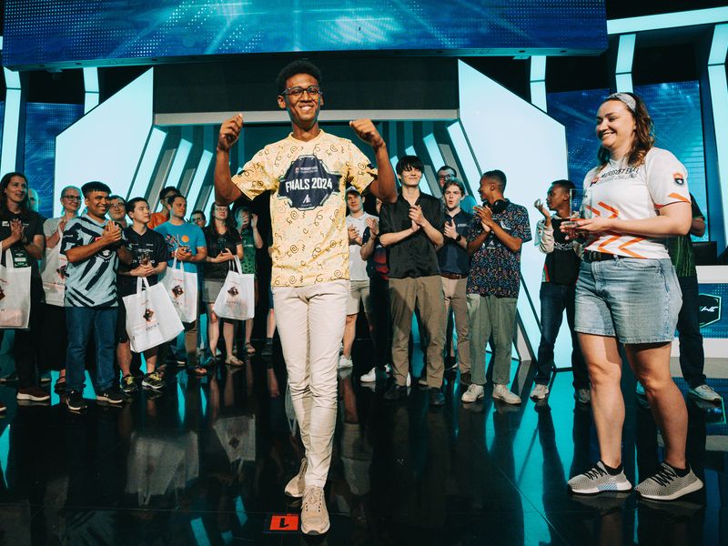 A competitor walks out to applause from the rest of the field at the European Open student finals.